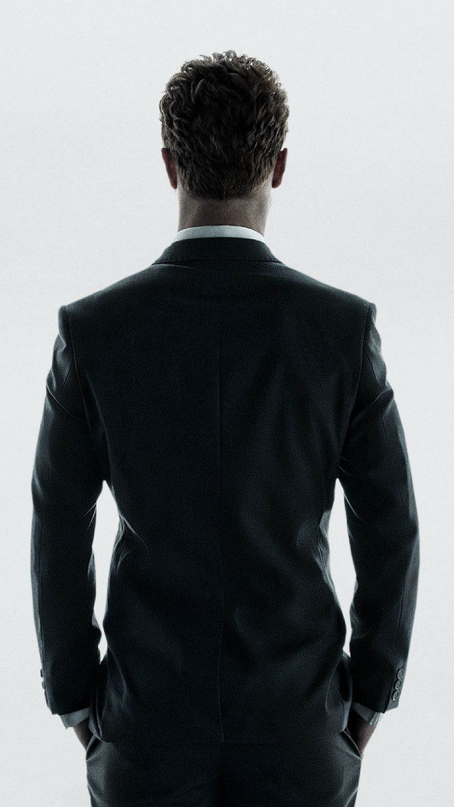 Man suit standing back camera free wallpaper - medium preview image