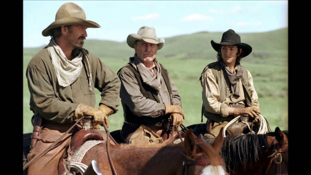 Cowboys riding horses field hills free wallpaper - medium preview image