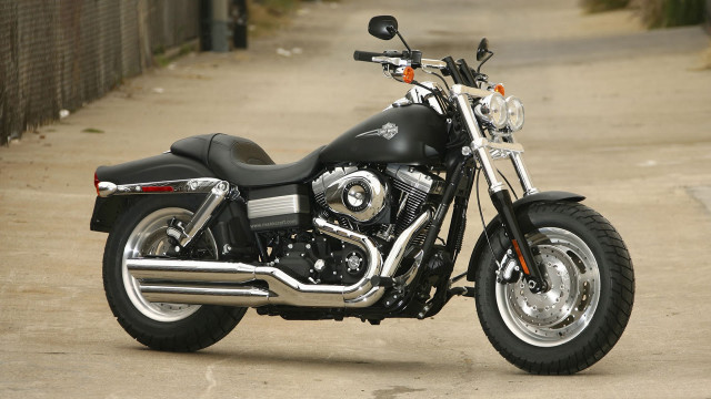 Black motorcycle sidewalk fence building free wallpaper - medium preview image