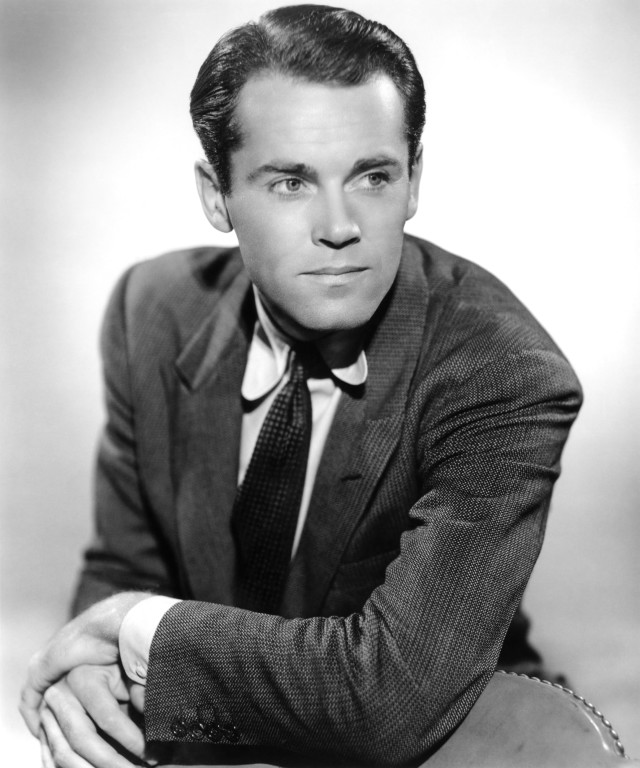 Charles mahoney suit crossed arm free wallpaper - medium preview image