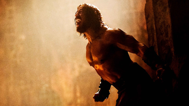 Cave man shirtless light gloves free wallpaper - medium preview image