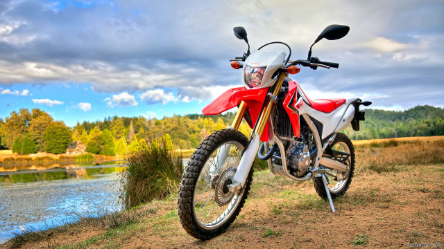 Red motorcycle dirt field river free wallpaper - medium preview image