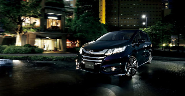 Black car night street buildings free wallpaper - medium preview image