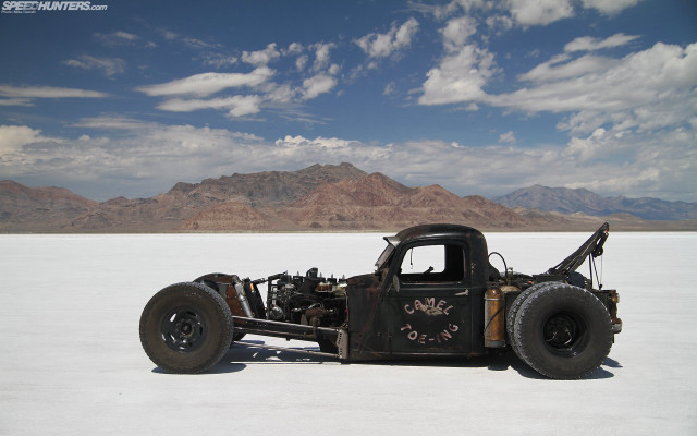 Truck flatbed desert mountains cloudy free wallpaper - medium preview image