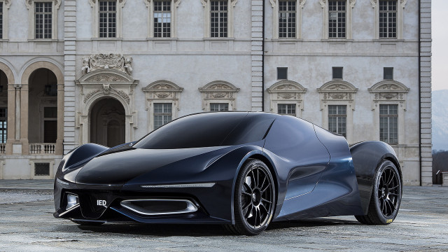 Futuristic car parked large building free wallpaper - medium preview image