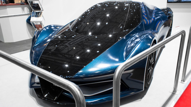 Futuristic car showroom exhibition display free wallpaper - medium preview image