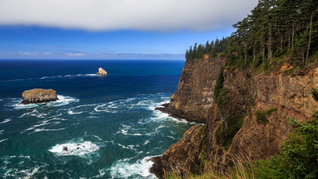 Cliff ocean rock boat scenery free wallpaper for desktop - medium preview image