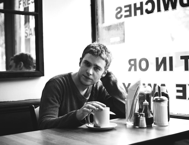 Man sitting table coffee sign free wallpaper - medium preview image