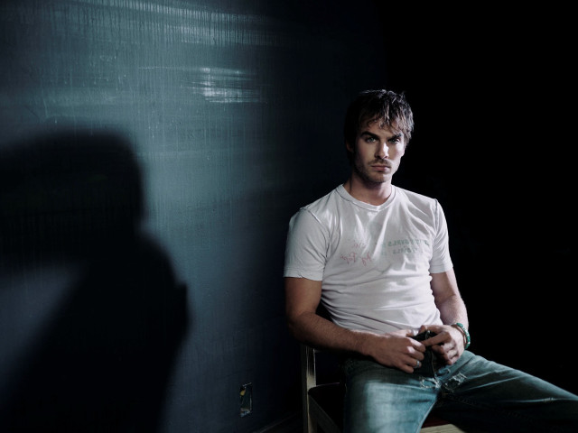 Man sitting dark room shadow free wallpaper - medium preview image