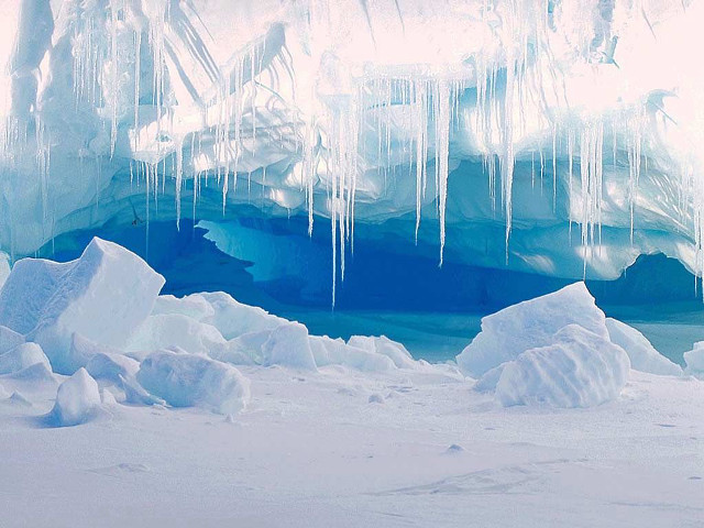 Large iceberg person standing ice free wallpaper - medium preview image