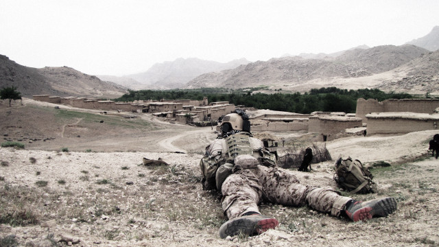 Soldier laying ground legs crossed #2 free wallpaper - medium preview image