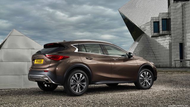 Brown car parked building large free wallpaper - medium preview image