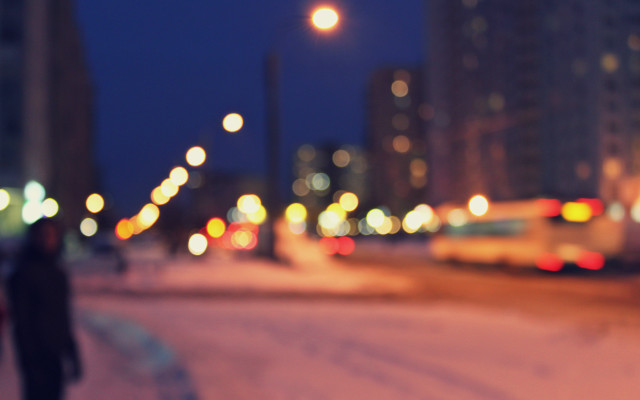 Person walking snowy street night free wallpaper for desktop - medium preview image