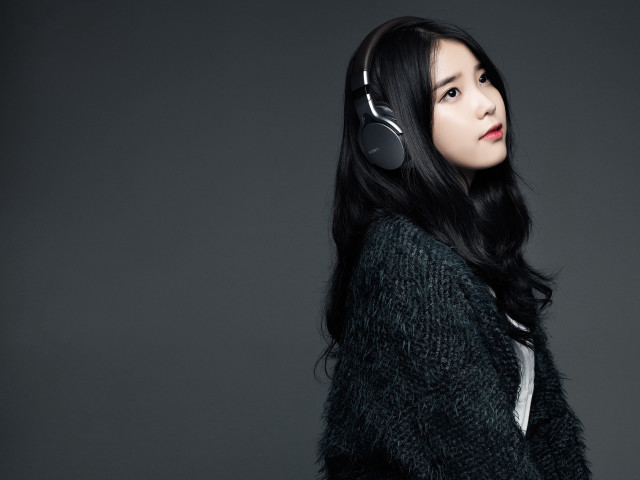 Woman headphones looking up dark free wallpaper - medium preview image