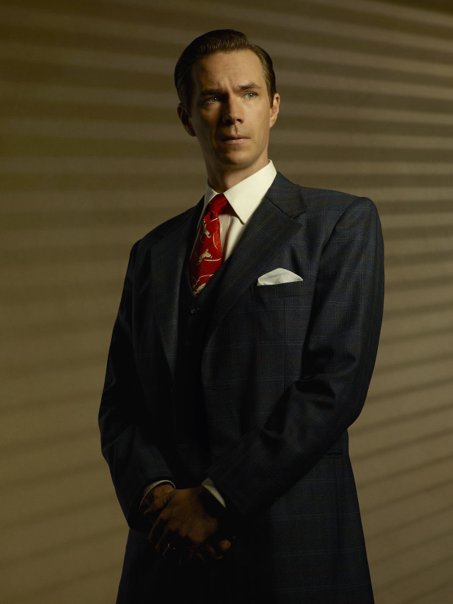 Man suit tie standing wall free wallpaper - medium preview image