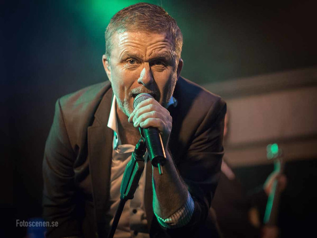 Man singing suit microphone stage #2 free wallpaper - medium preview image
