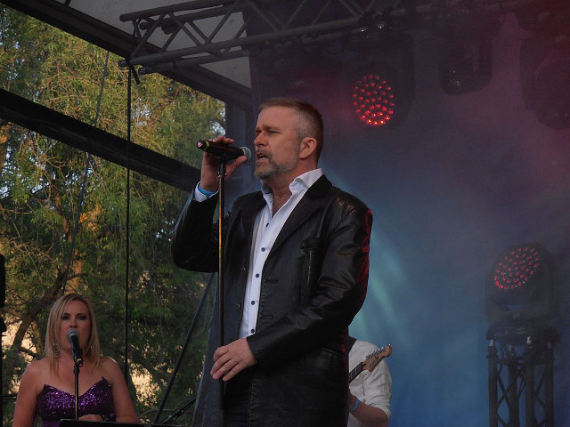 Man stage microphone singing performance #2 free wallpaper - medium preview image