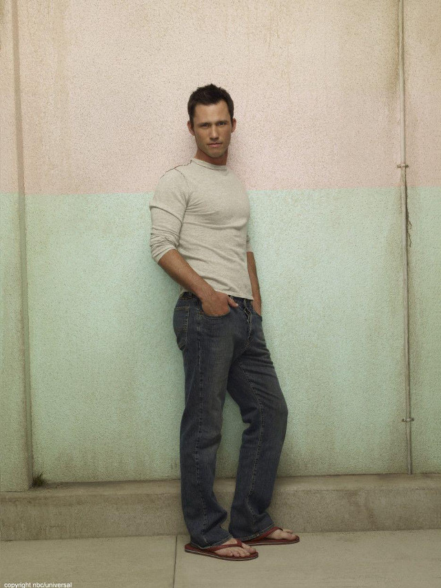 Man leaning against wall hands free wallpaper - medium preview image