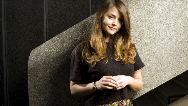 Woman standing wall hands folded free wallpaper - medium preview image