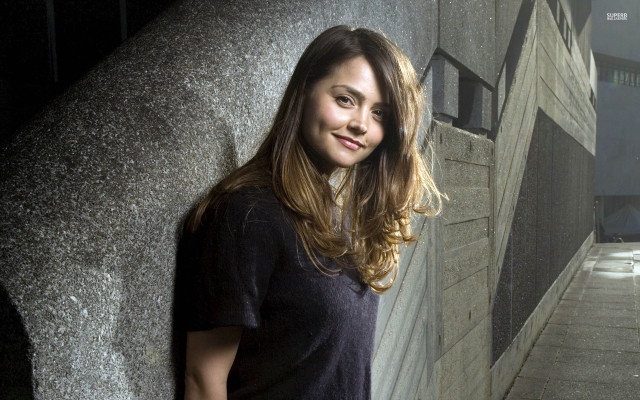 Woman standing wall building light free wallpaper - medium preview image