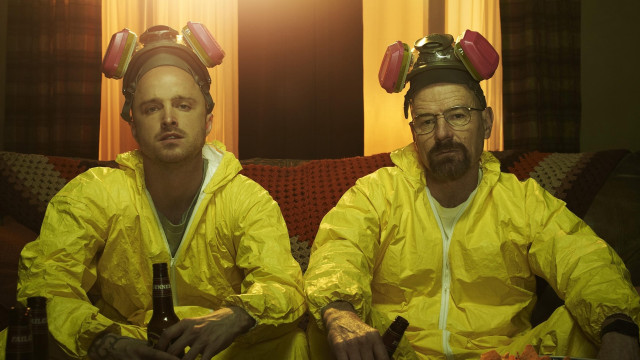 Two men yellow raincoats couch free wallpaper - medium preview image
