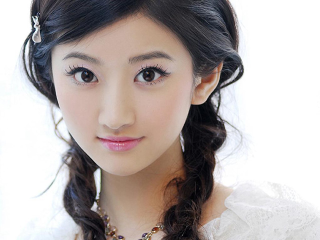 Woman braid necklace white shirt free wallpaper - medium preview image