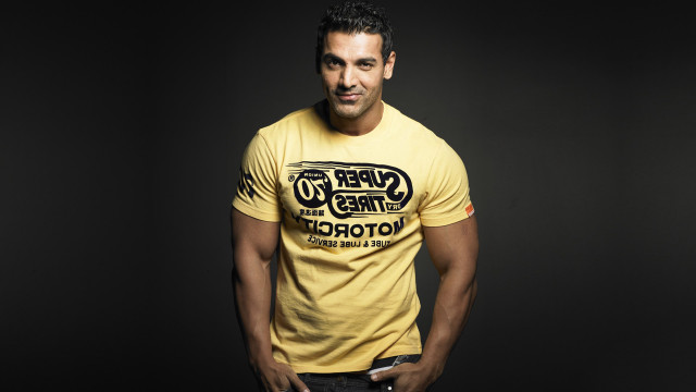 Man yellow shirt pose hands free wallpaper - medium preview image