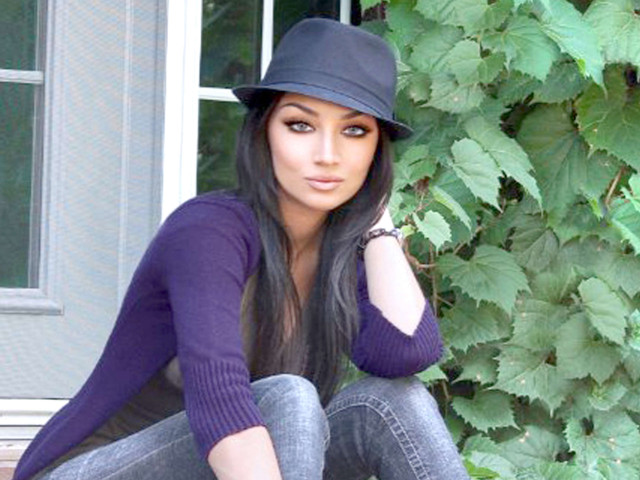 Woman sitting hat jeans purple free wallpaper - medium preview image