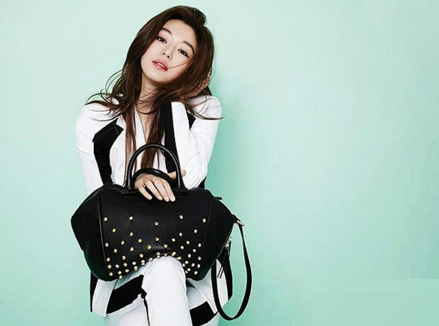 Woman sitting chair holding purse free wallpaper - medium preview image