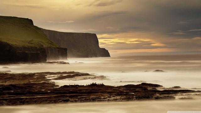 Rocky beach cliff water cloudy free wallpaper - medium preview image