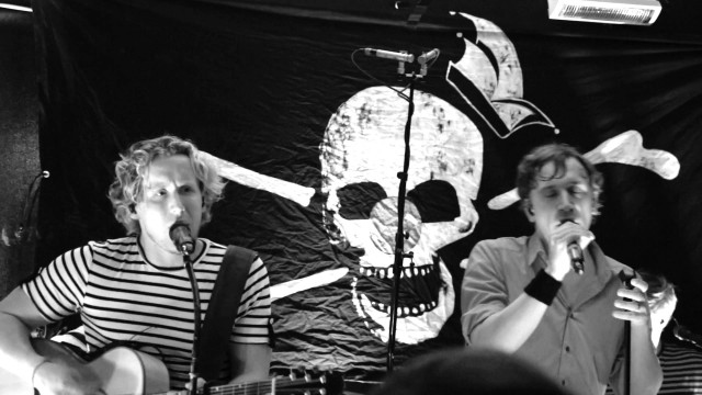 Singing duo skull wall microphones free wallpaper - medium preview image