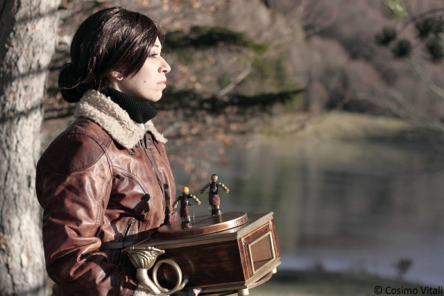 Woman holding wooden box figurines free wallpaper - medium preview image