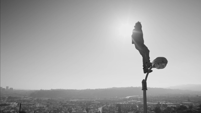Person standing pole hat city free wallpaper - medium preview image