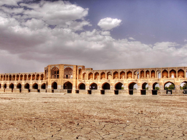 Large building arches sky clouds free wallpaper - medium preview image