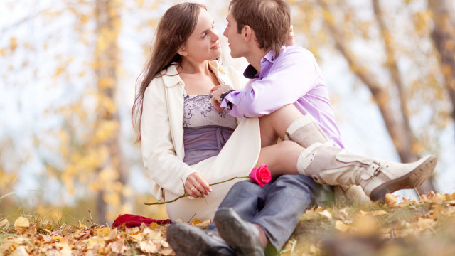 Man woman sitting ground leaves #5 free wallpaper - medium preview image