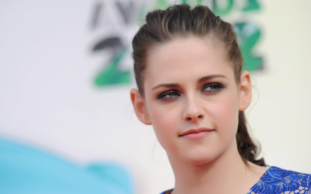Woman ponytail blue eyeshadow serious free wallpaper - medium preview image