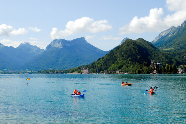 Canoes lake mountains town group free wallpaper for desktop - medium preview image