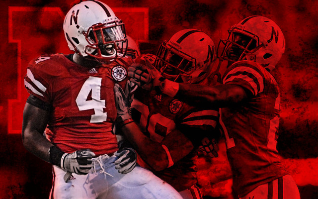 Football player holding football background #2 free wallpaper - medium preview image