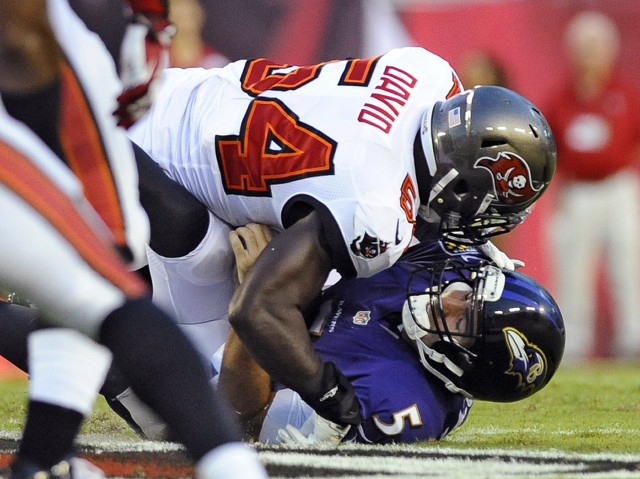 Football player tackled on field free wallpaper - medium preview image