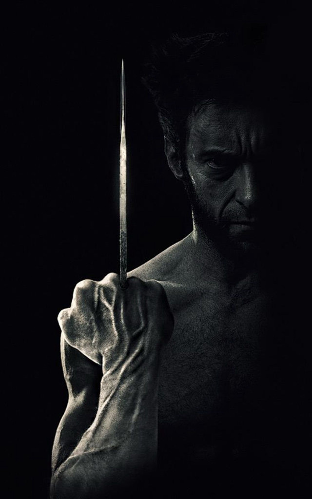Man holding knife dark shirt #2 free wallpaper - medium preview image