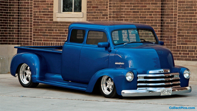 Blue truck brick building side free wallpaper - medium preview image