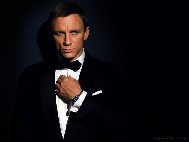 Tuxedo man adjusting tie dark free wallpaper - medium preview image