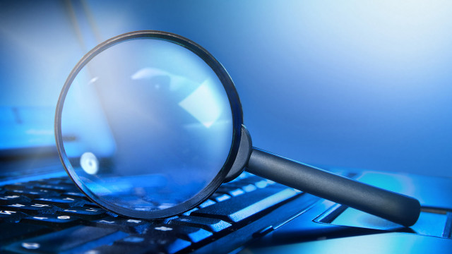 Magnifying glass laptop keyboard desk free wallpaper - medium preview image