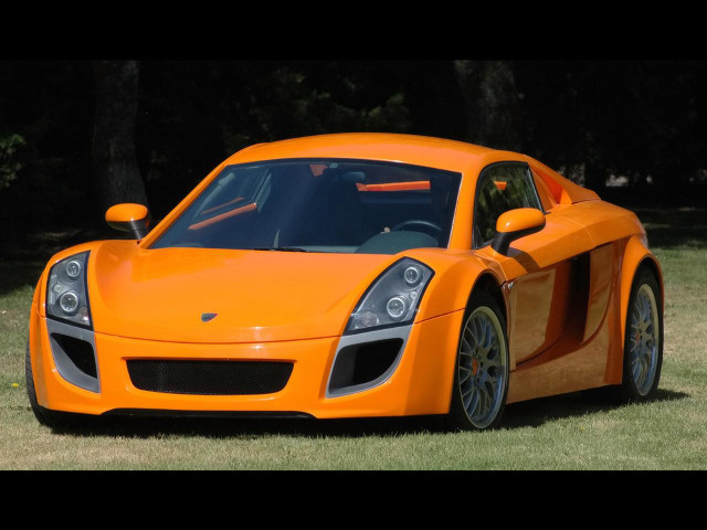 Bright orange sports car parked free wallpaper - medium preview image