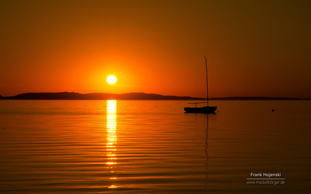 Boat sunset water peaceful scenery free wallpaper - medium preview image