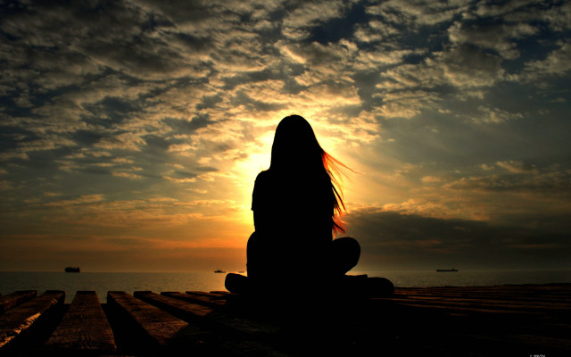 Woman sitting dock sunset ocean free wallpaper - medium preview image
