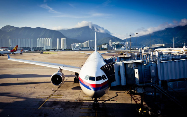 Jetliner airport tarmac terminal mountain free wallpaper - medium preview image
