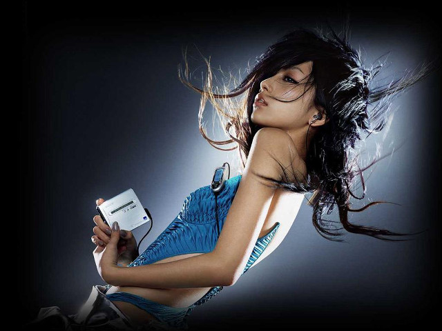 Woman blue dress holding phones free wallpaper - medium preview image