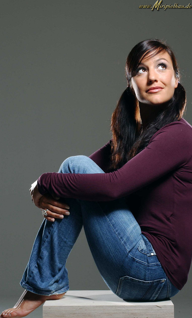 Woman sitting concrete pose portrait free wallpaper - medium preview image