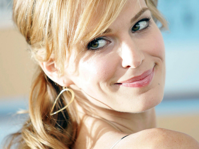 Smiling woman cell phone blue free wallpaper - medium preview image